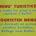 13 gerichte  Dann servieren Sie uns als "erstes Gericht" bitte eine Vorspeise, als "zweites" nehmen wir die Hauptspeise. Werbeschild am Bozner Busbahnhof.